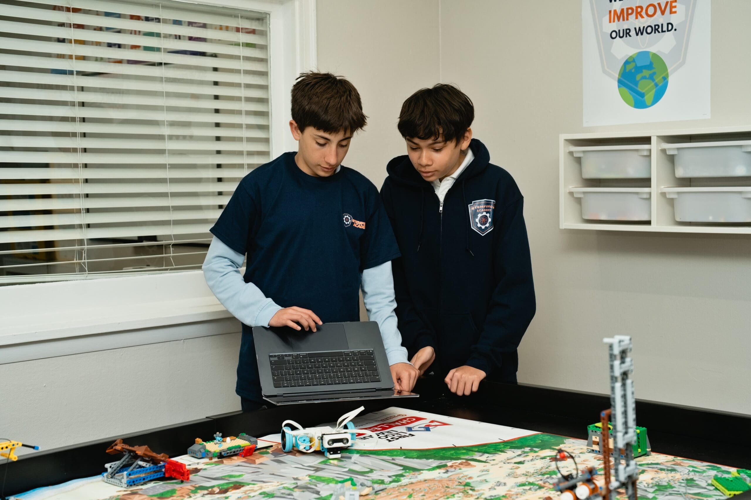 Students collaborating on a game design project at STEMForce