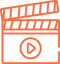 A minimalist icon illustration of a film clapper board with a centered play button symbol, rendered in orange lines.